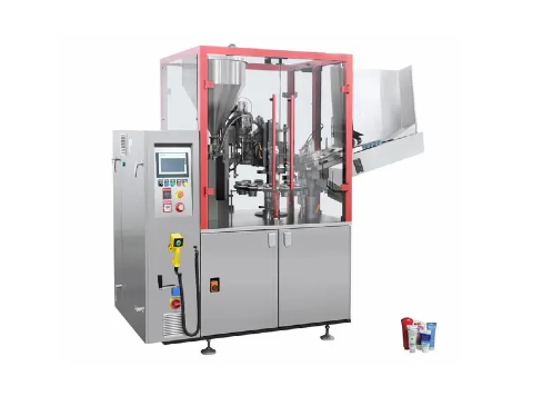 Как трубчатая наполнителя и машины для уплотнения обтекания косметической упаковки